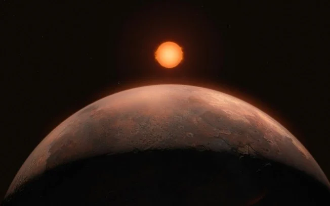 Uma impressão artística de um exoplaneta recém-descoberto, menor que a Terra, com a estrela de Barnard no fundo Uma impressão artística de um exoplaneta recém-descoberto, menor que a Terra, com a estrela de Barnard no fundo