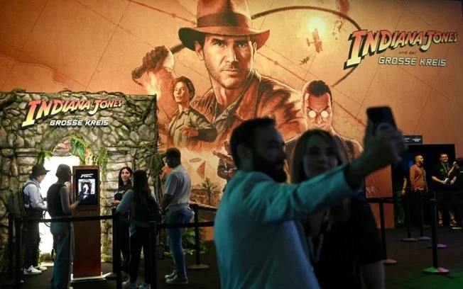 Visitantes no pavilhão do jogo “Indiana Jones and the Great Circle” na Gamescom em Colônia, Alemanha, em 21 de agosto de 2024 Visitantes no pavilhão do jogo “Indiana Jones and the Great Circle” na Gamescom em Colônia, Alemanha, em 21 de agosto de 2024