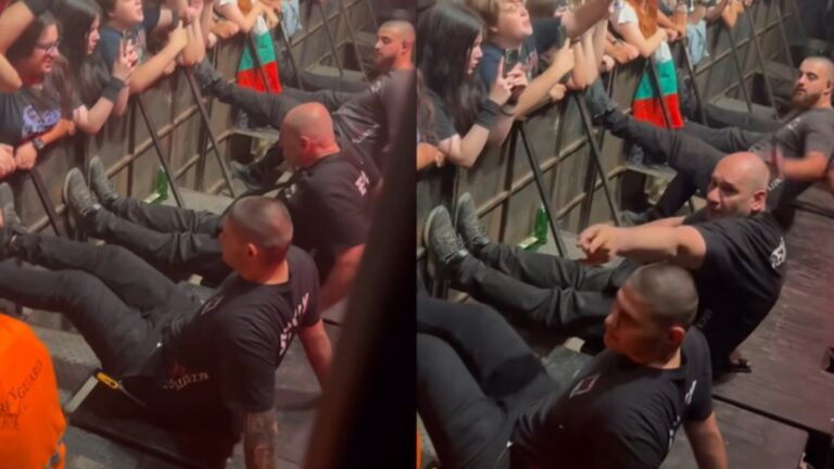 Seguranças fazem barreira para grade não cair em show