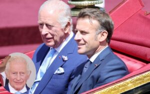 Rei Charles aparece com olho vermelho em evento com Macron